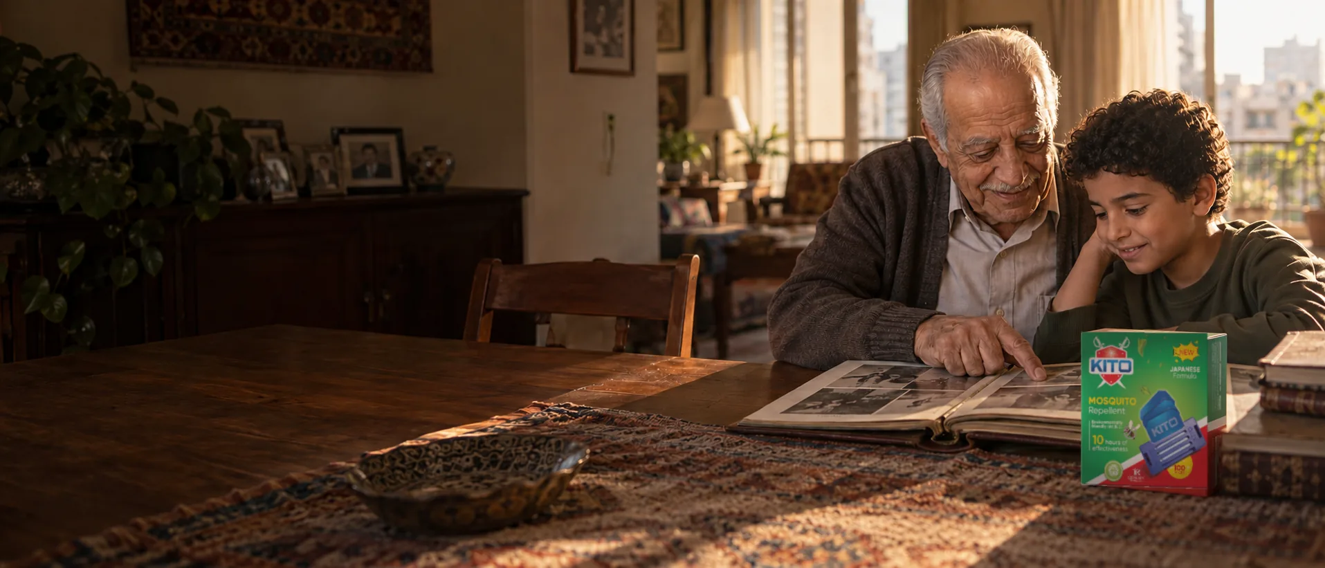 Egyptian grandfather and grandson looking at a family photo album